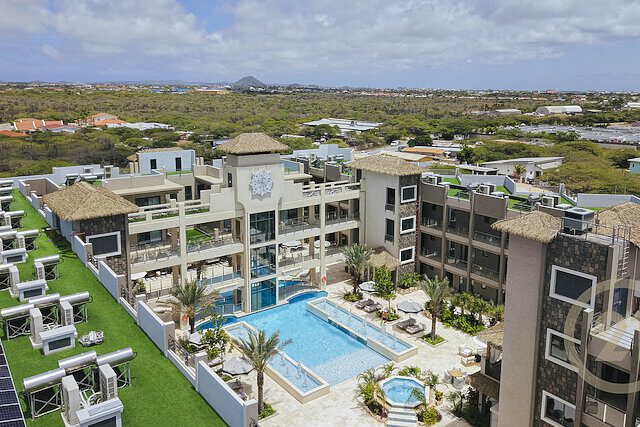 Walishali condominium buildings around a courtyard pool